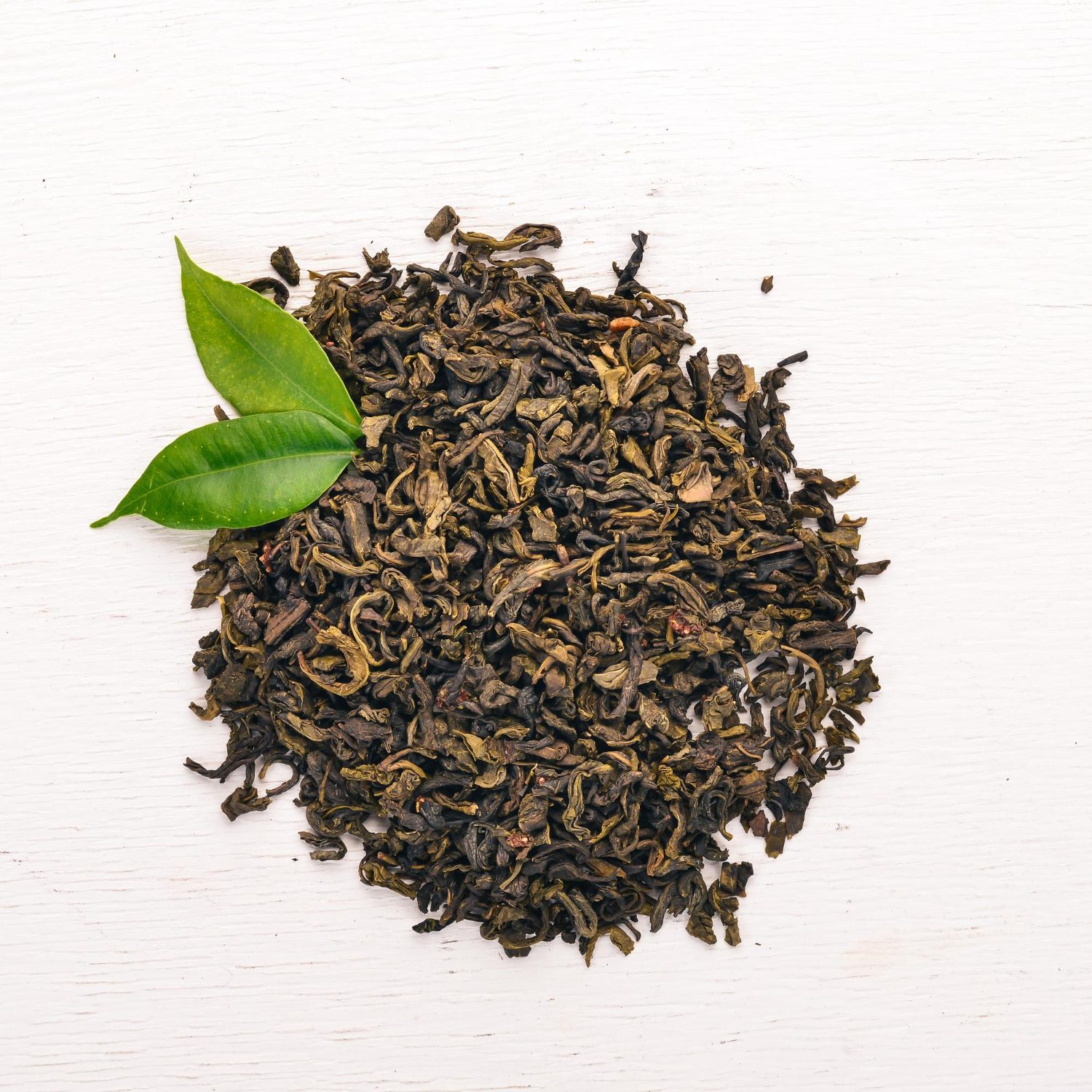 dry-green-tea-wooden-background-top-view-copy-space